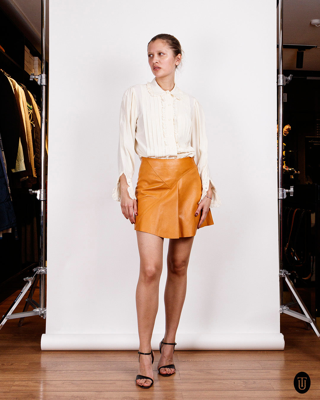 An 80s Gianni Versace leather mini skirt S